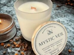 Soy candle with "Mystic Veil" label.