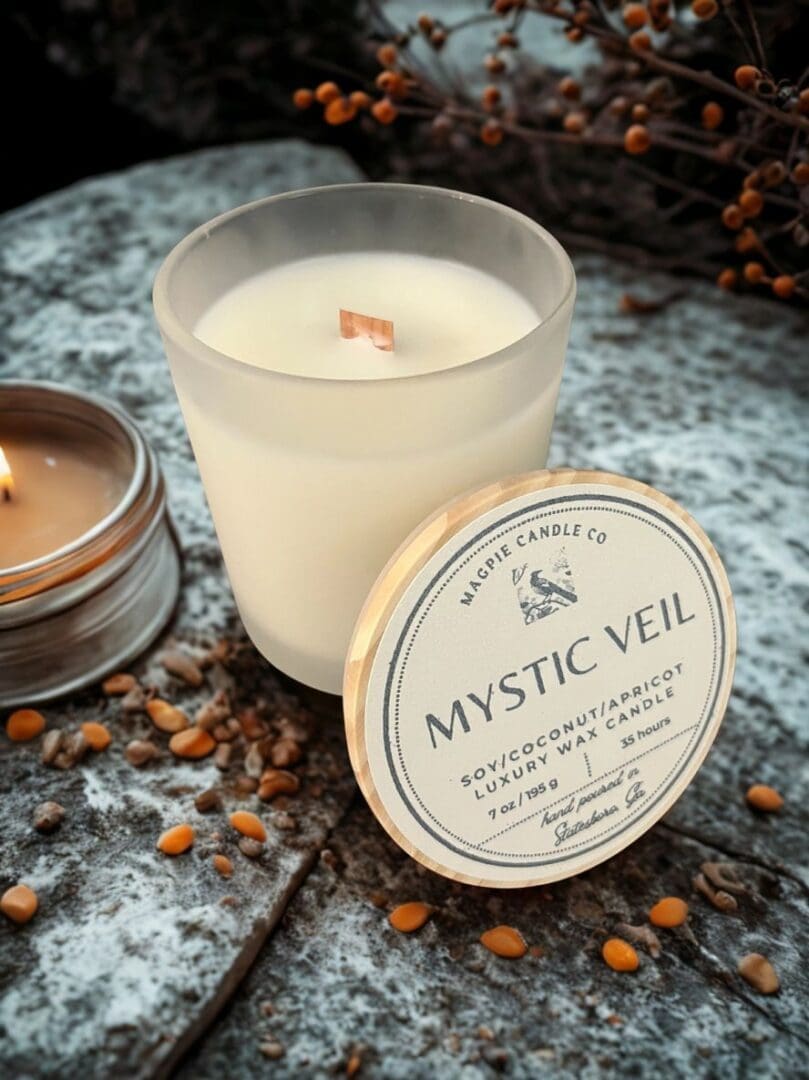 Soy candle with "Mystic Veil" label.